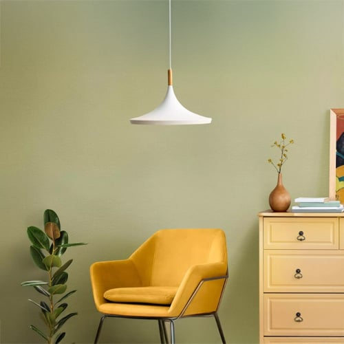 Corner lighting setup with pendant lights and warm glow creating cozy and stylish home decor ambiance.