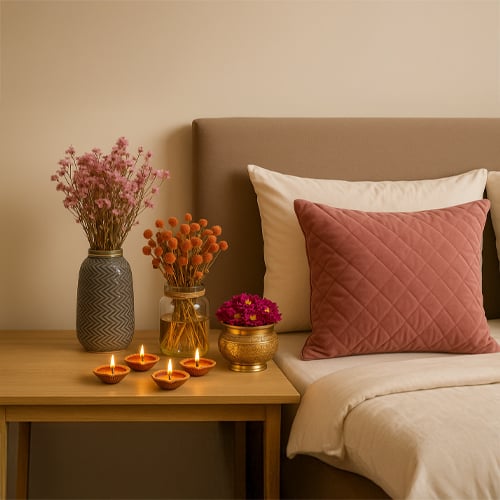 Cozy home decor setup with candles flowers and soft elements creating warm and thoughtful living space ambiance.