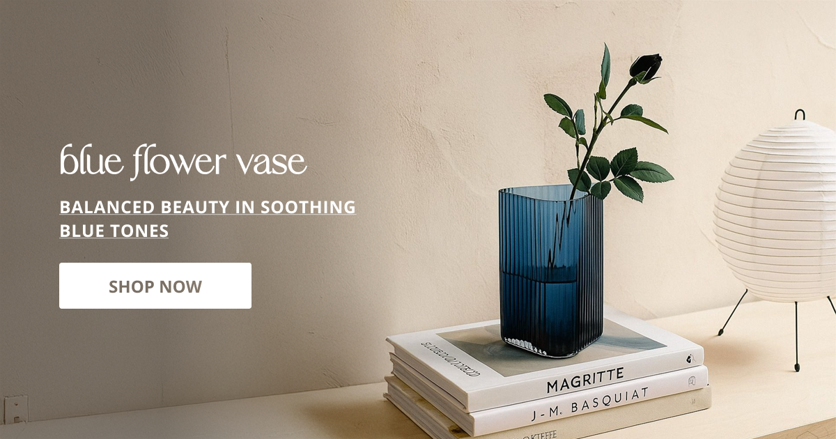 Blue flower vase with modern ceramic design perfect for table styling living room decor and home interior.