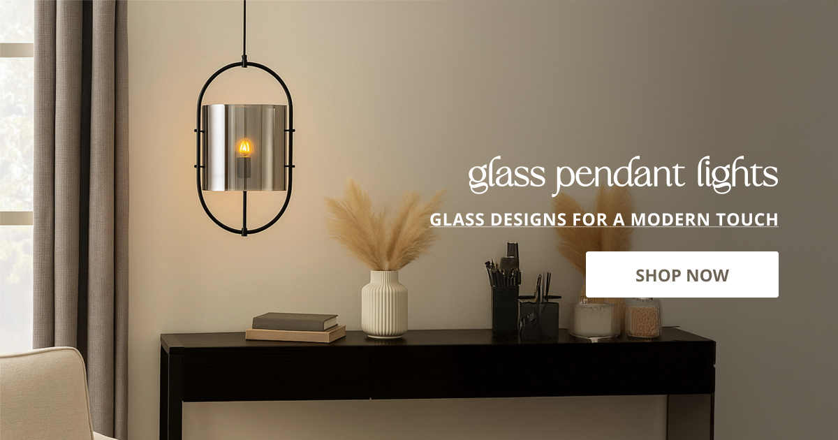 Glass pendant lights styled above console table creating soft ambient glow for modern elegant interiors.