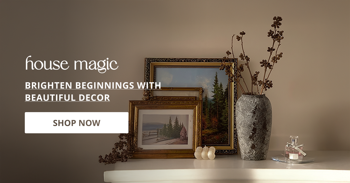 Housewarming decor styled with framed art and vase creating warm welcoming aesthetic for modern homes.