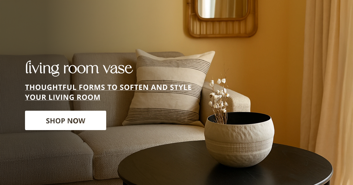 Living room vase styled on coffee table with textured design enhancing cozy and modern home decor feel.