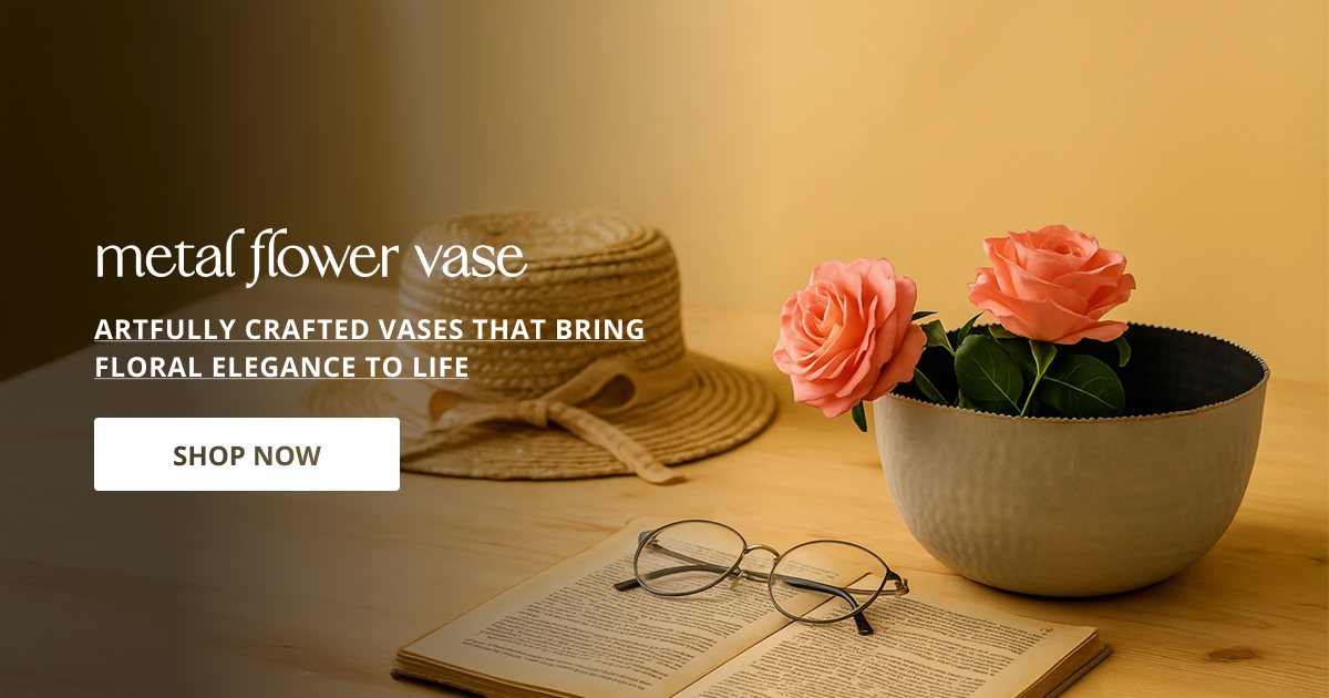 Metal flower vase styled with fresh blooms on table creating elegant decorative accent for modern homes.