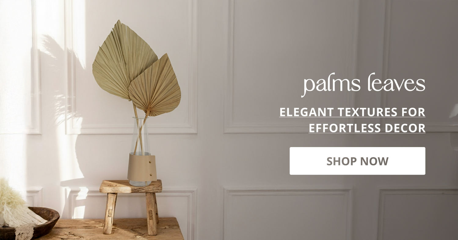 Dried palm leaves and decorative foliage arranged in vase creating natural aesthetic look for modern home decor styling.