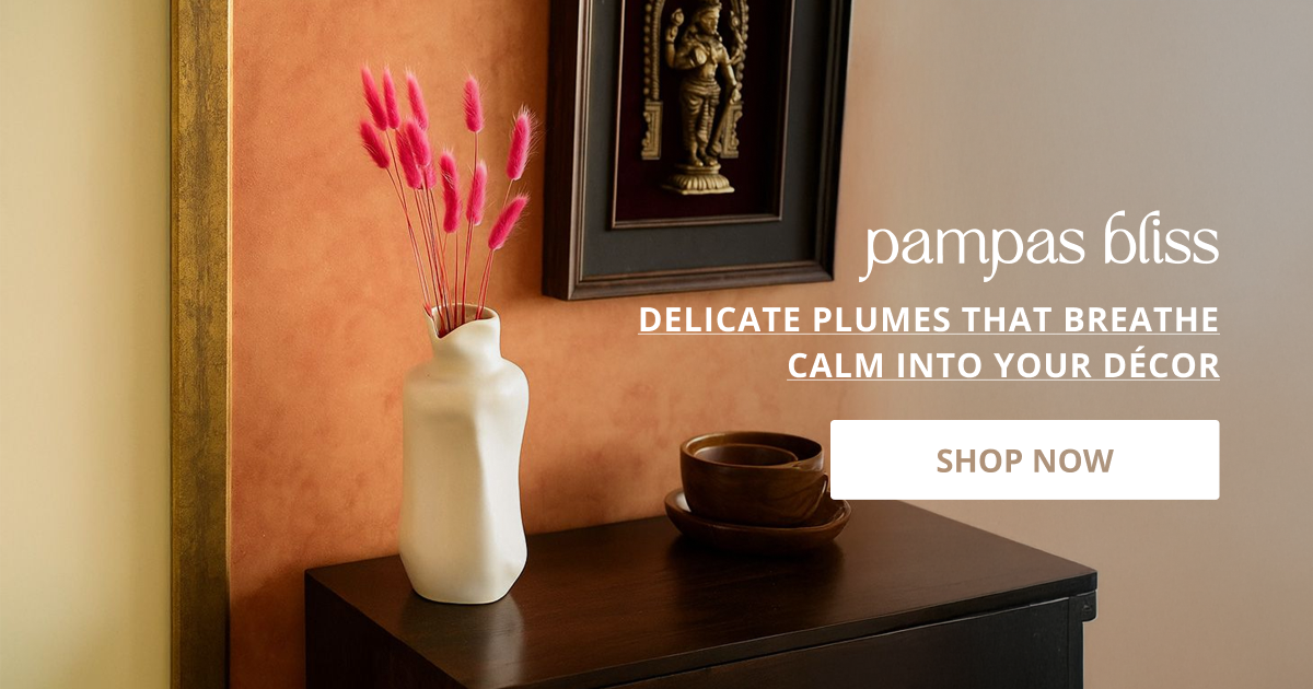 Pampas grass for decoration styled in vase on side table creating calm modern aesthetic home decor look.