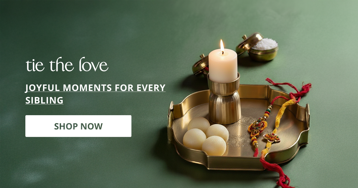Raksha bandhan decor styled with festive thali and candles creating traditional joyful celebration setup.