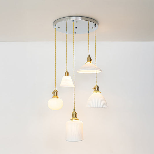 White metal pendant lights with gold accents showcasing stylish designs for modern home decor spaces.