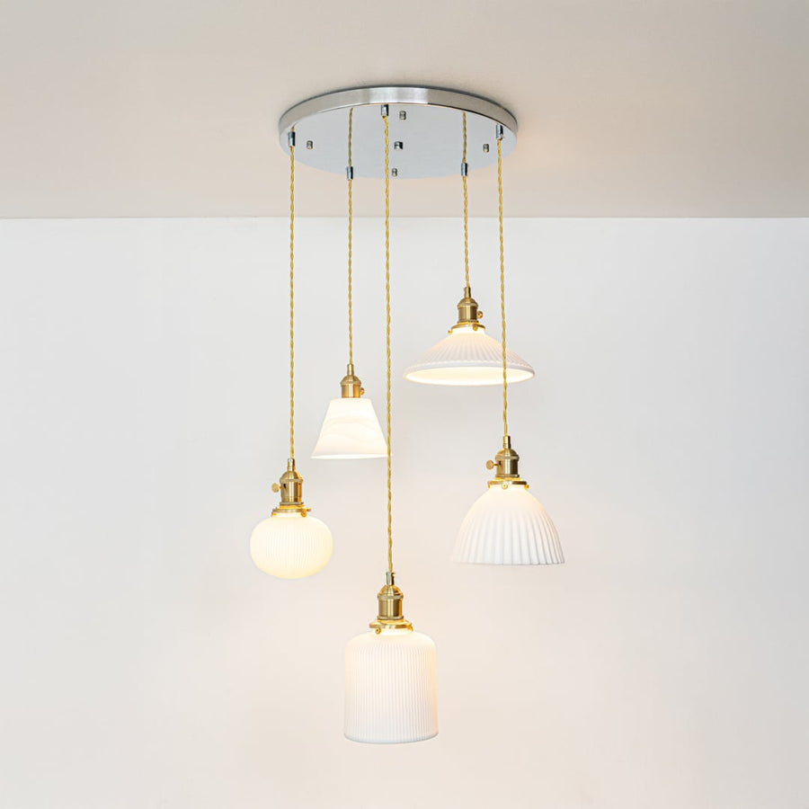 White metal pendant lights with gold accents showcasing stylish designs for modern home decor spaces.