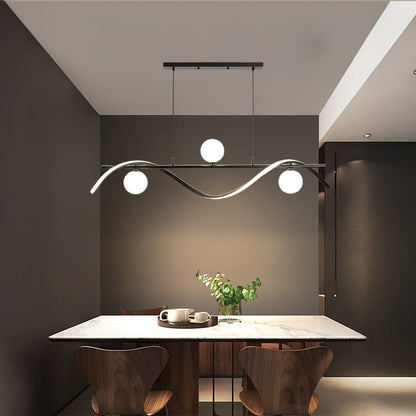 Modern black wave chandelier with white globe lights styled in a contemporary room creating elegant ceiling lighting.