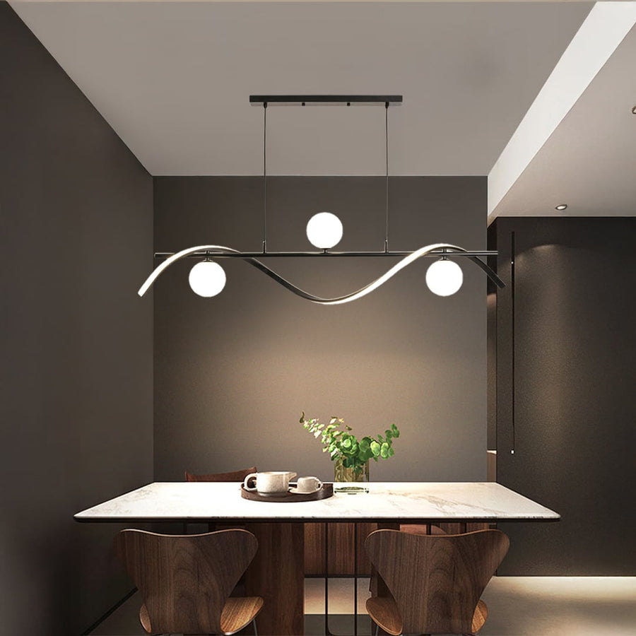 Modern black wave chandelier with white globe lights styled in a contemporary room creating elegant ceiling lighting.