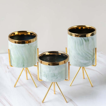 Marble mini planter with gold stand presented on a crisp white marble background  highlighting its compact size and modern style.