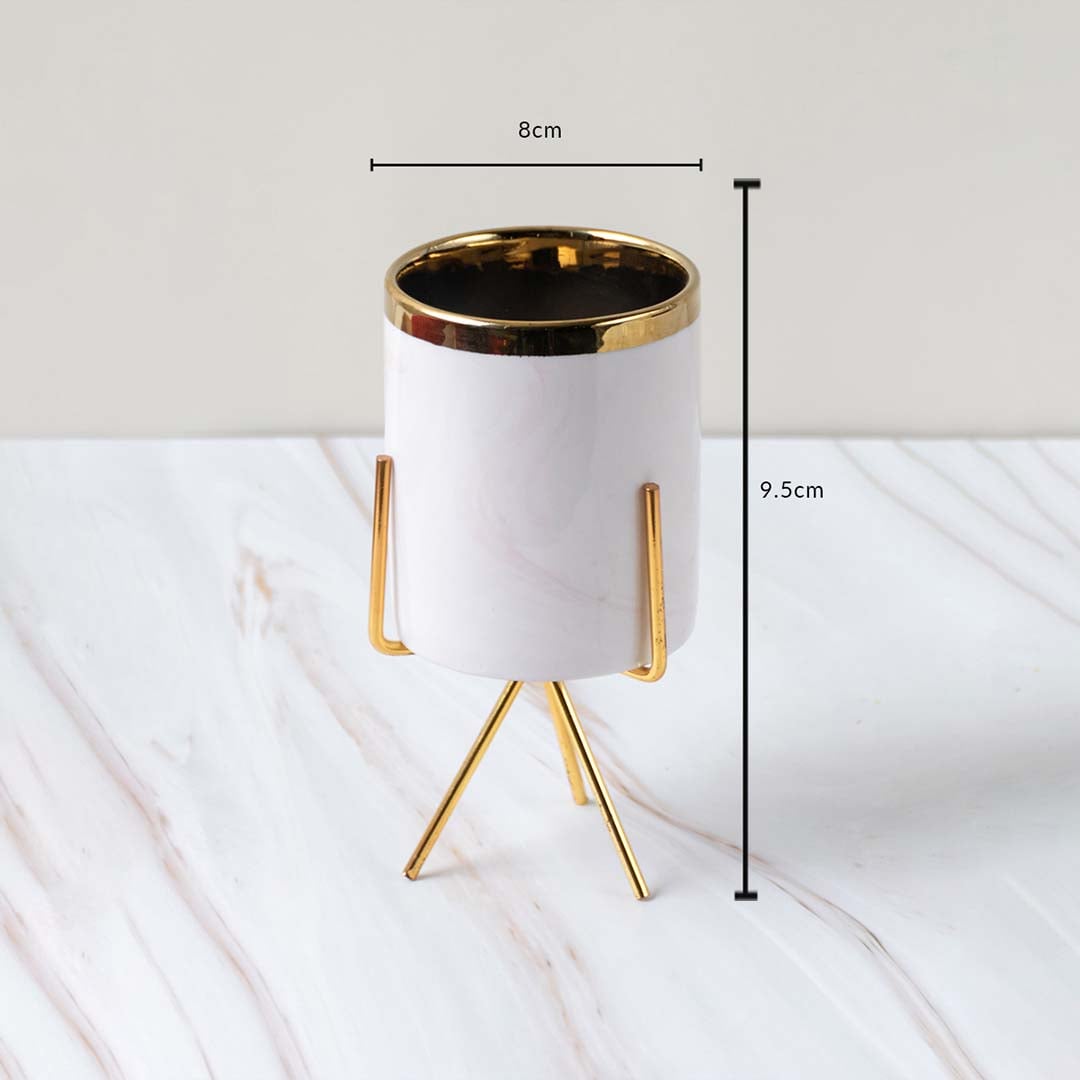 A white marble finish planter with a gold stand displayed with clear measurements of 8 cm width and 9.5 cm height for accurate size reference.