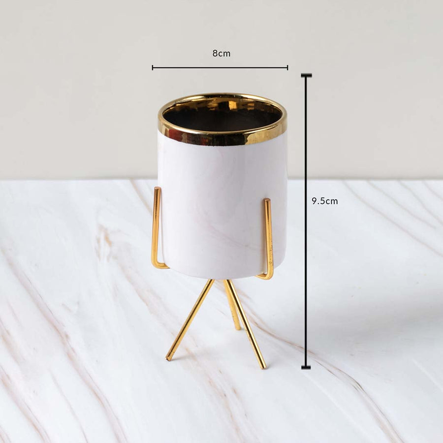 A white marble finish planter with a gold stand displayed with clear measurements of 8 cm width and 9.5 cm height for accurate size reference.