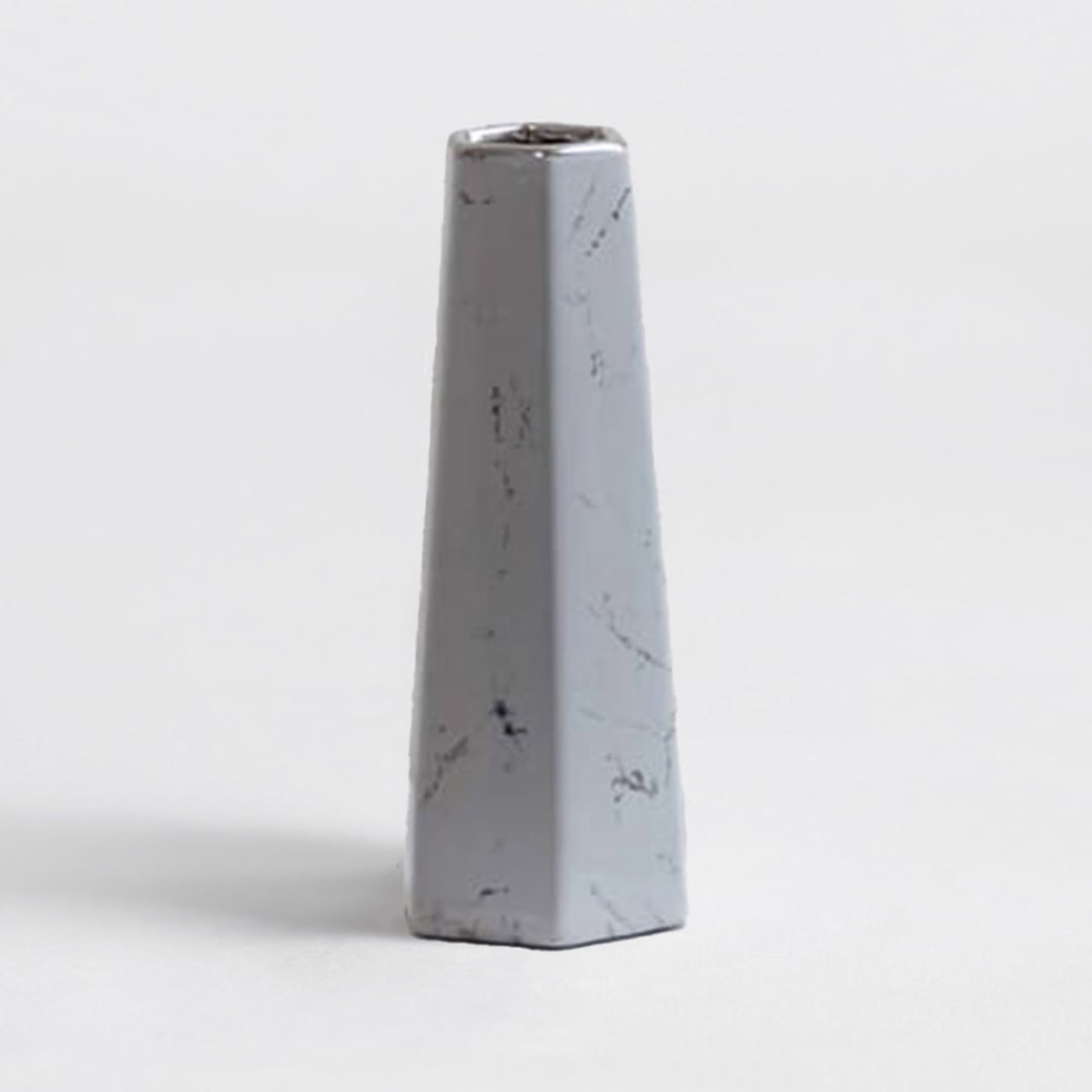 Modern white marble ceramic vase with smooth finish and geometric design crafted for stylish living room decor.
