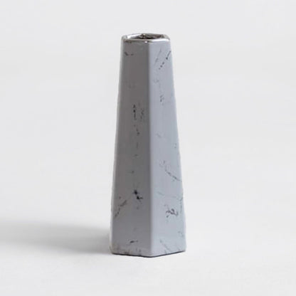 Modern white marble ceramic vase with smooth finish and geometric design crafted for stylish living room decor.