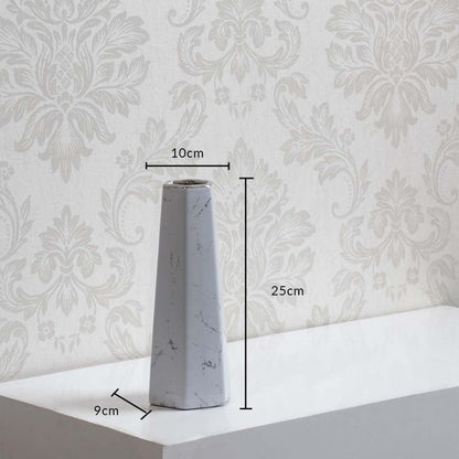White marble ceramic vase geometric shape size 25cm height 10cm width 9cm depth perfect for modern home decor.