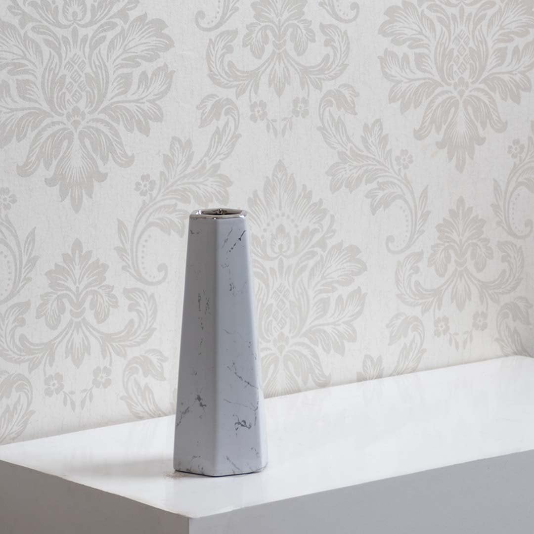 Decorative white marble ceramic vase with geometric design ideal for modern home interior and tabletop styling.