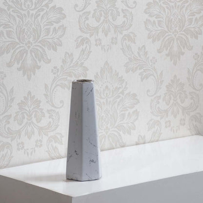 Decorative white marble ceramic vase with geometric design ideal for modern home interior and tabletop styling.