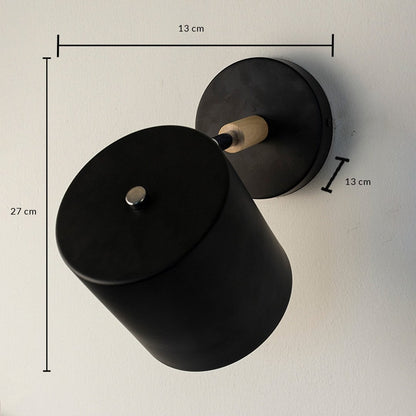 Black metal wall light showing 27 cm height 11 cm width and 7 cm projection dimensions suitable for modern interior wall mounting.vv