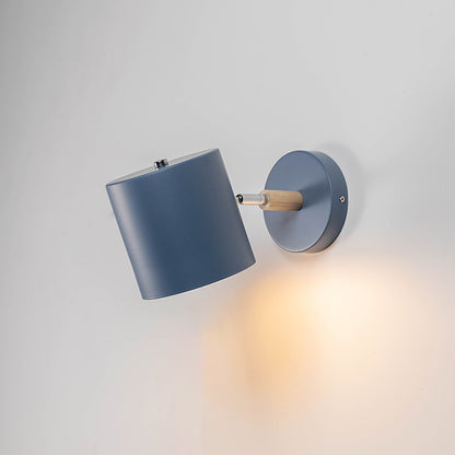 Contemporary blue metal spotlight wall light with warm glow for elegant modern interior lighting decor.