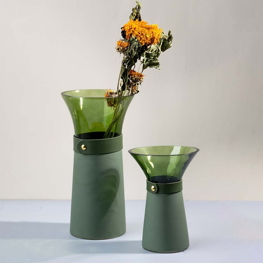 Set of green glass vases styled together as chic tabletop accents for modern and minimal decorative interiors.