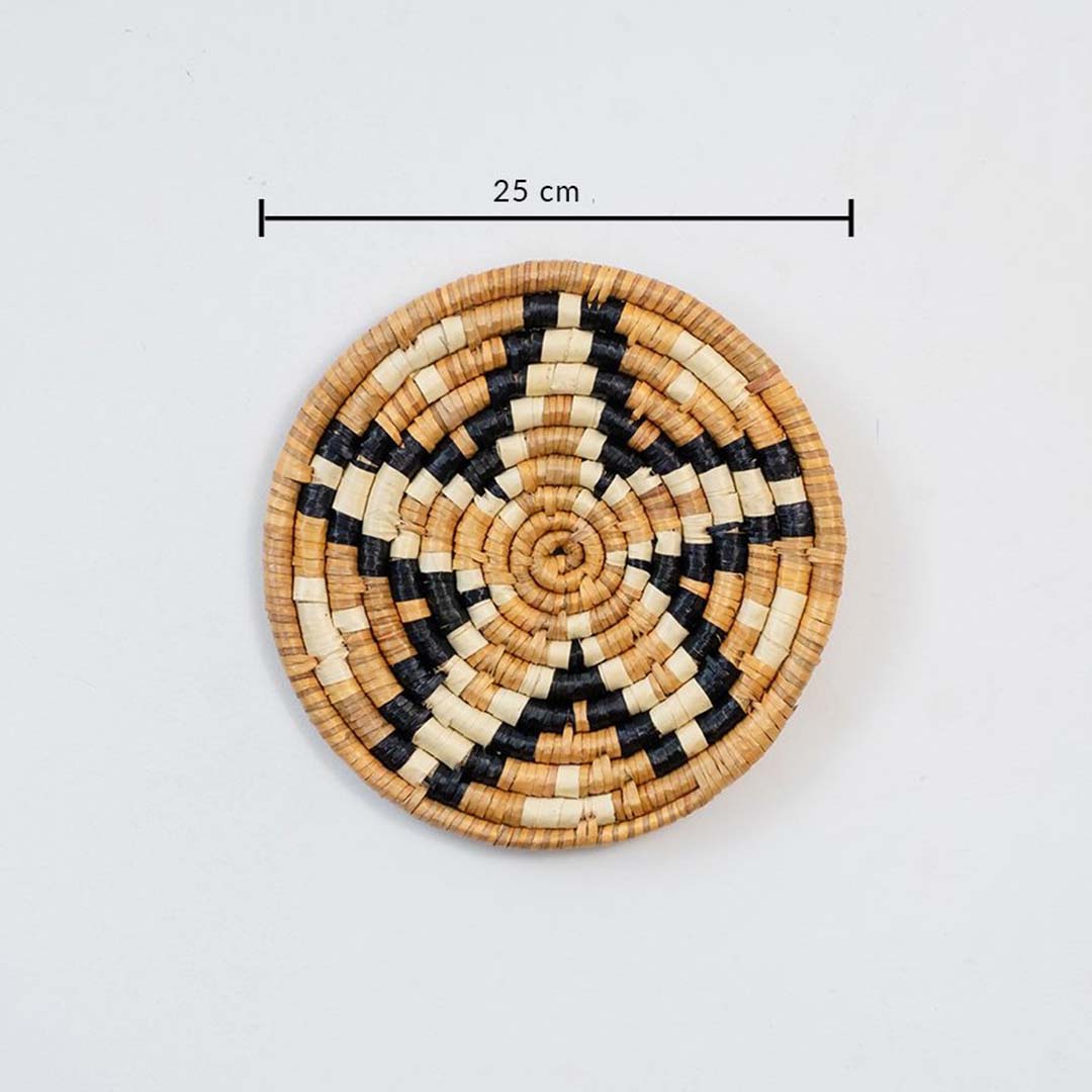 Small handcrafted round wall basket with geometric pattern showing 25 cm diameter for compact wall Decor arrangements.