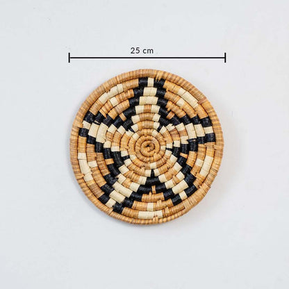 Small handcrafted round wall basket with geometric pattern showing 25 cm diameter for compact wall Decor arrangements.