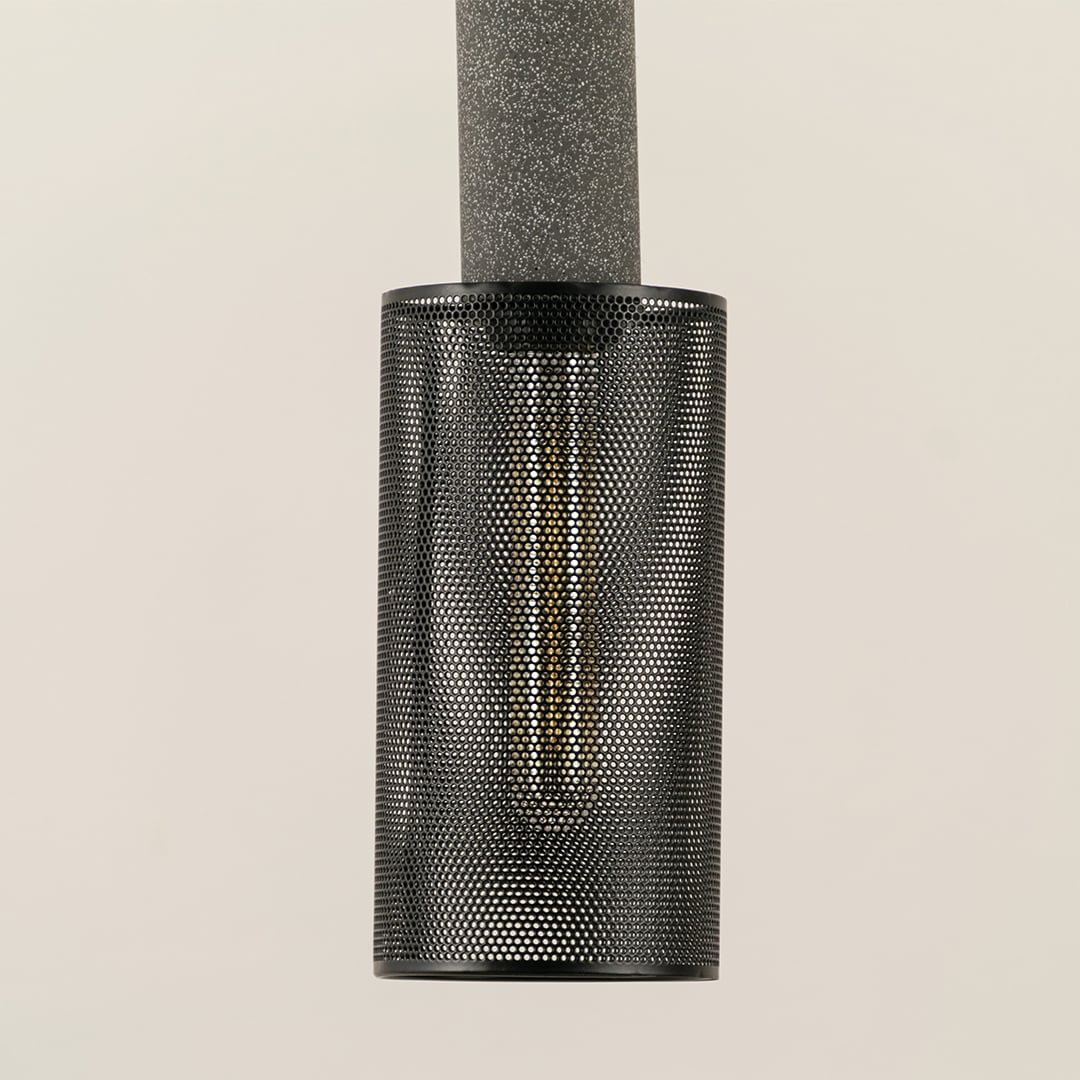 Closeup of Arlo Mesh pendant light showing fine perforated metal detailing and elegant cylindrical structure.
