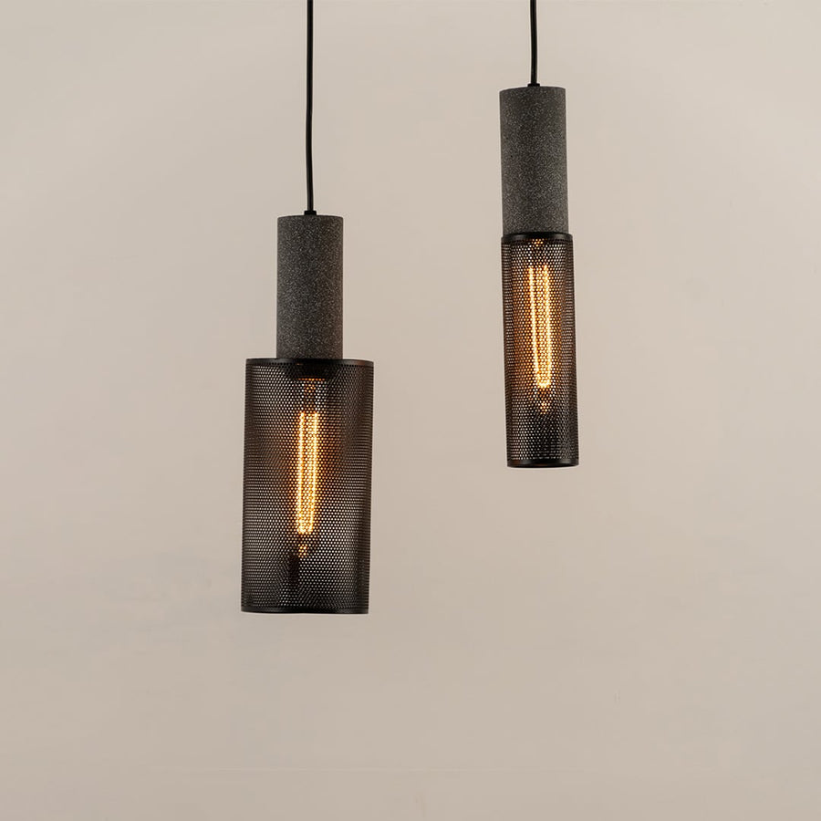 Arlo Mesh pendant lights glowing warmly together creating a cozy and industrial ambiance in modern decor.