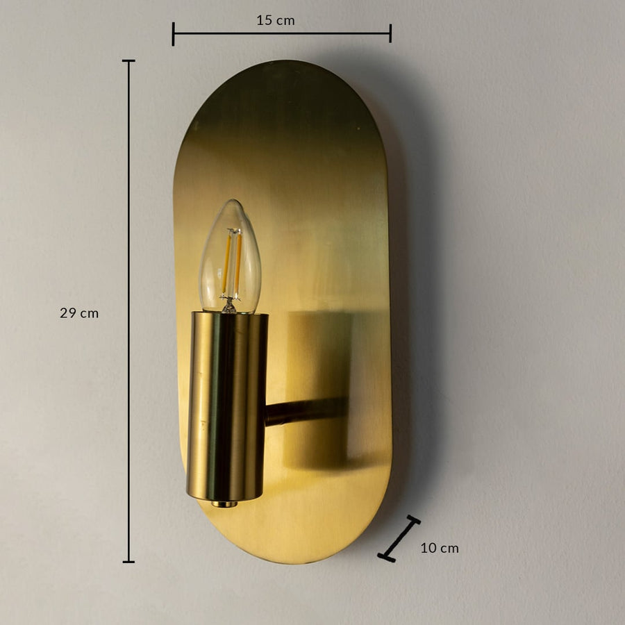 Gold wall sconce 29 cm tall 15 cm wide and 10 cm deep shown for size detail perfect for bedroom or hallway lighting.