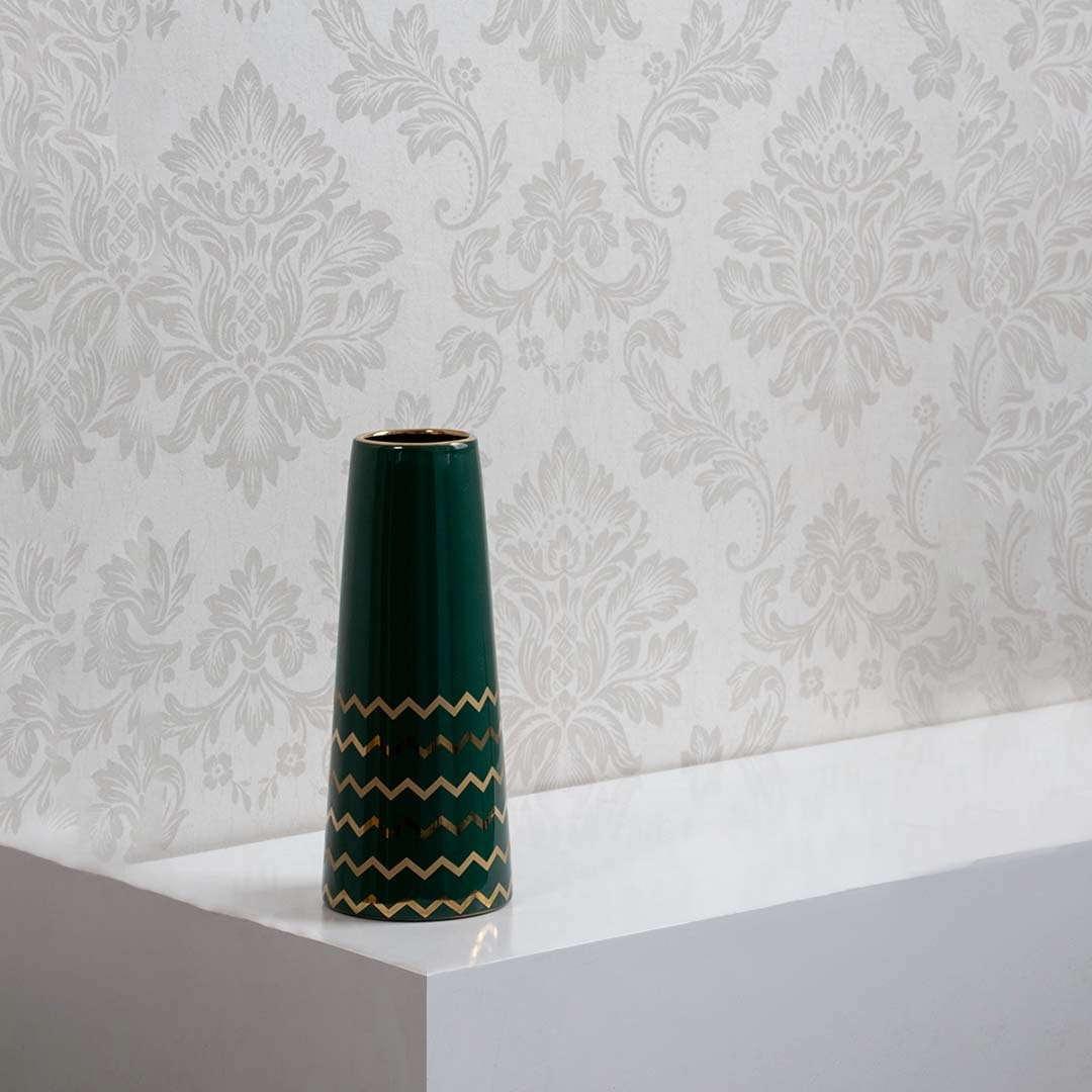 Glossy green ceramic vase with gold detailing displayed on white background for premium home decoration.