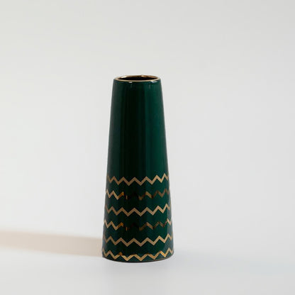 Dark green ceramic decorative vase with gold zigzag pattern for shelf styling and contemporary home decor displays.