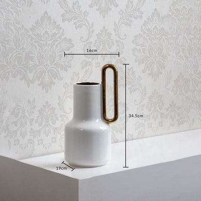 White ceramic vase with gold handle and 34.5 cm height and 19 cm width shown clearly for accurate home decor size reference.