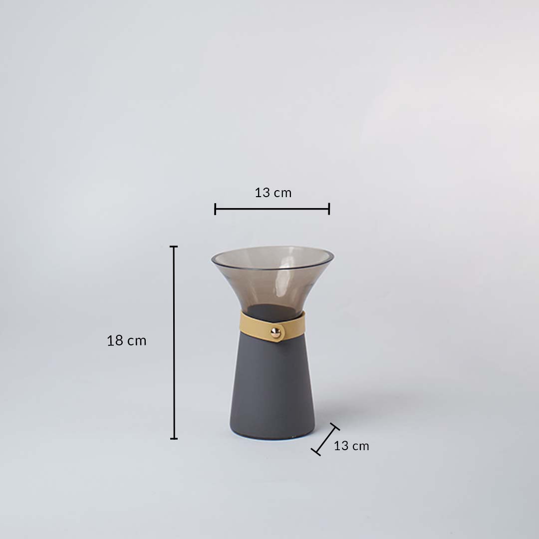 Smoky grey glass vase with 18 cm height and 13 cm width shown with wide mouth design for decorative interior use.
