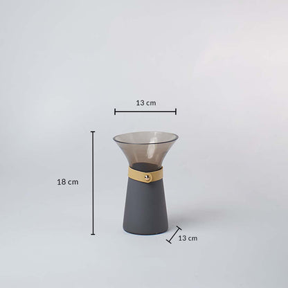 Smoky grey glass vase with 18 cm height and 13 cm width shown with wide mouth design for decorative interior use.