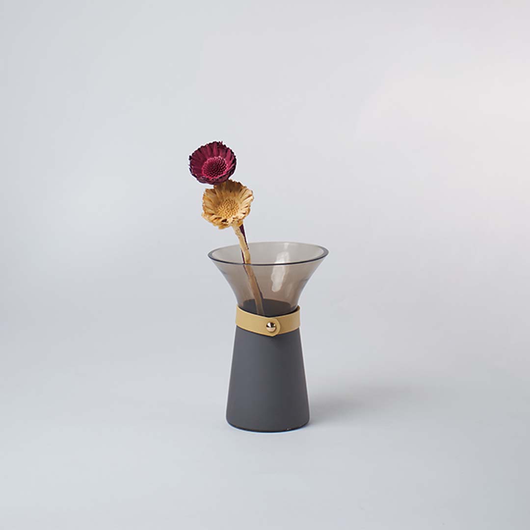 Smoky grey glass vase with wide mouth styled with dried flowers adding elegance to modern lifestyle home decor.