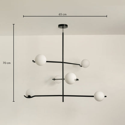 Black metal chandelier with white globes shown with 65 cm width and 70 cm height for modern stylish ceiling lighting.
