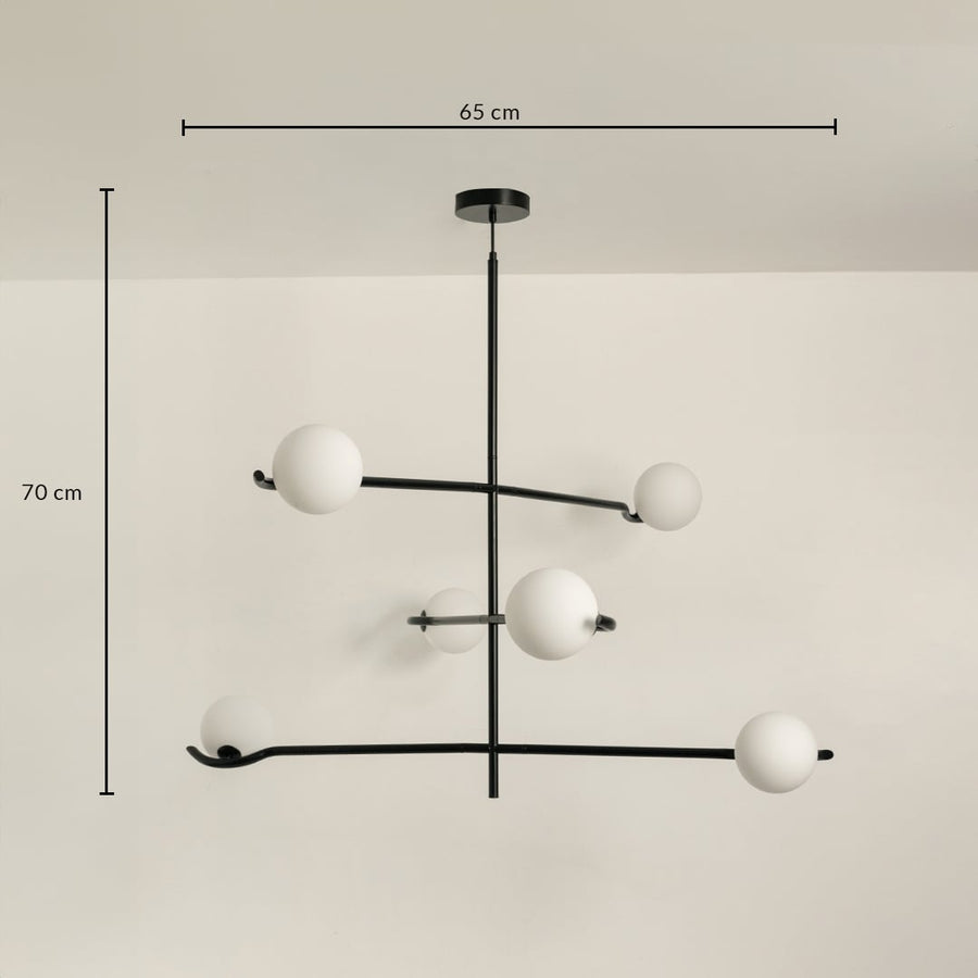 Black metal chandelier with white globes shown with 65 cm width and 70 cm height for modern stylish ceiling lighting.