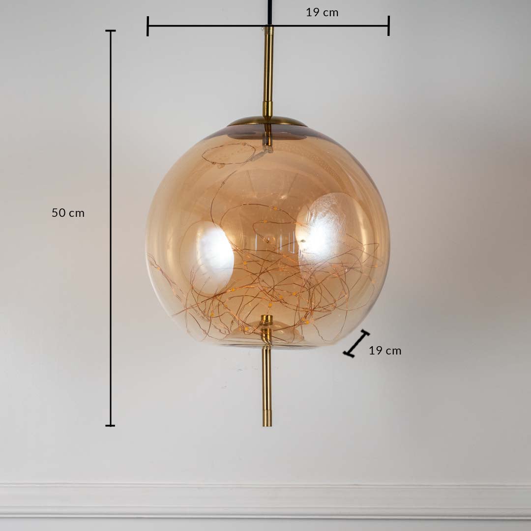 Amber glass globe pendant ceiling light with height 50 cm and diameter 19 cm shown clearly on off white background wall.