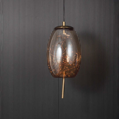 Amber glass and gold pendant ceiling light with intricate filament design displayed stylishly against black background.