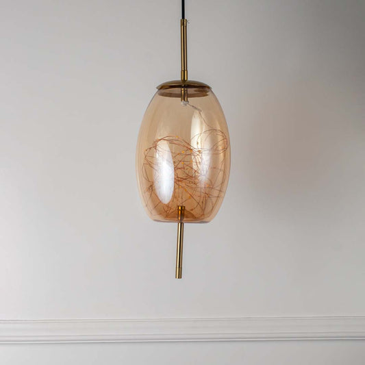 Amber glass and gold pendant ceiling light with artistic filament design displayed elegantly on off white background