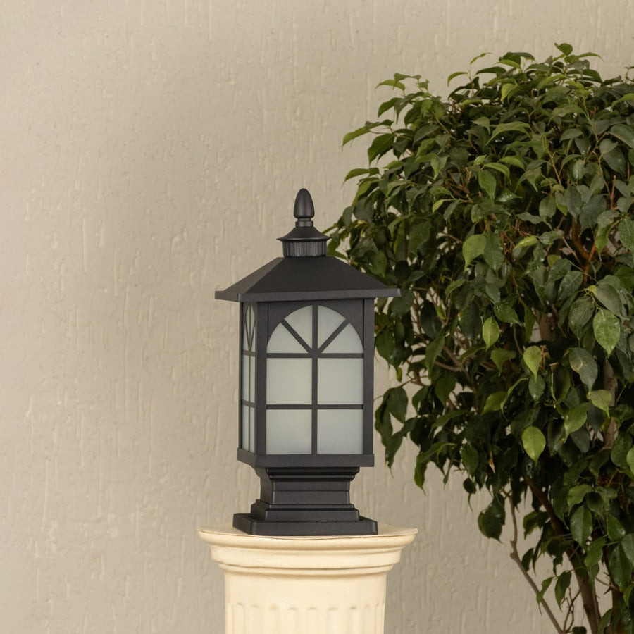 Black outdoor gate light with frosted glass panels for stylish modern exterior decor use.