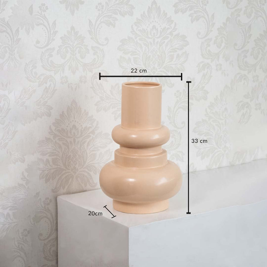 Peach sculptural vase dimension display showing height 33 cm  width 22 cm  and base depth 20 cm against a minimal white background.