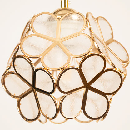 Gold metal geometric pendant light closeup showcasing artistic frame for luxurious modern ceiling lighting decor.
