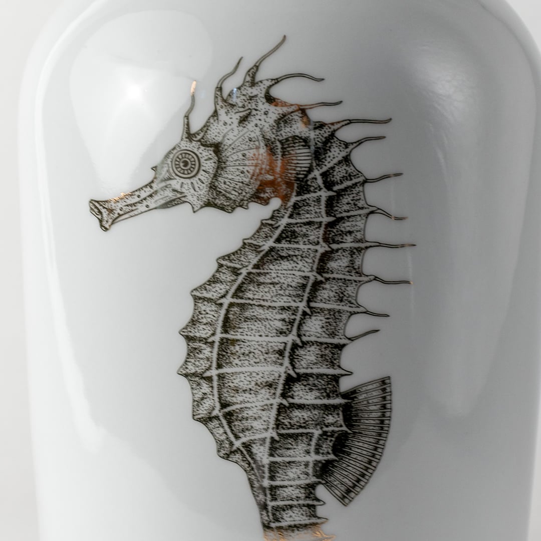 Grey ceramic vase with detailed seahorse illustration displayed in a closeup view highlighting textured strokes artistic shading and modern nautical décor for stylish contemporary homes.