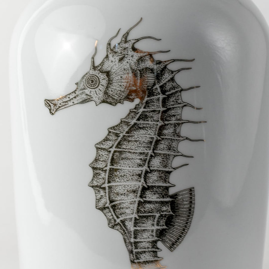 Grey ceramic vase with detailed seahorse illustration displayed in a closeup view highlighting textured strokes artistic shading and modern nautical décor for stylish contemporary homes.