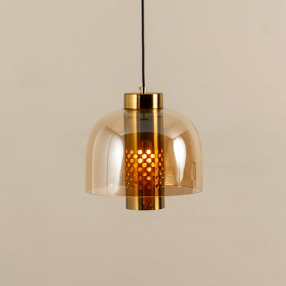 Elegant amber glass pendant light with gold metal finish for stylish kitchen and dining room decor styling.