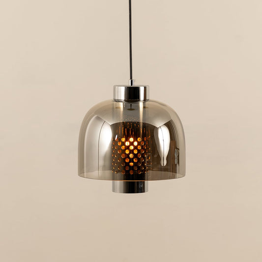 Smoke glass pendant light illuminated to display elegant ceiling lighting with contemporary decorative appeal.