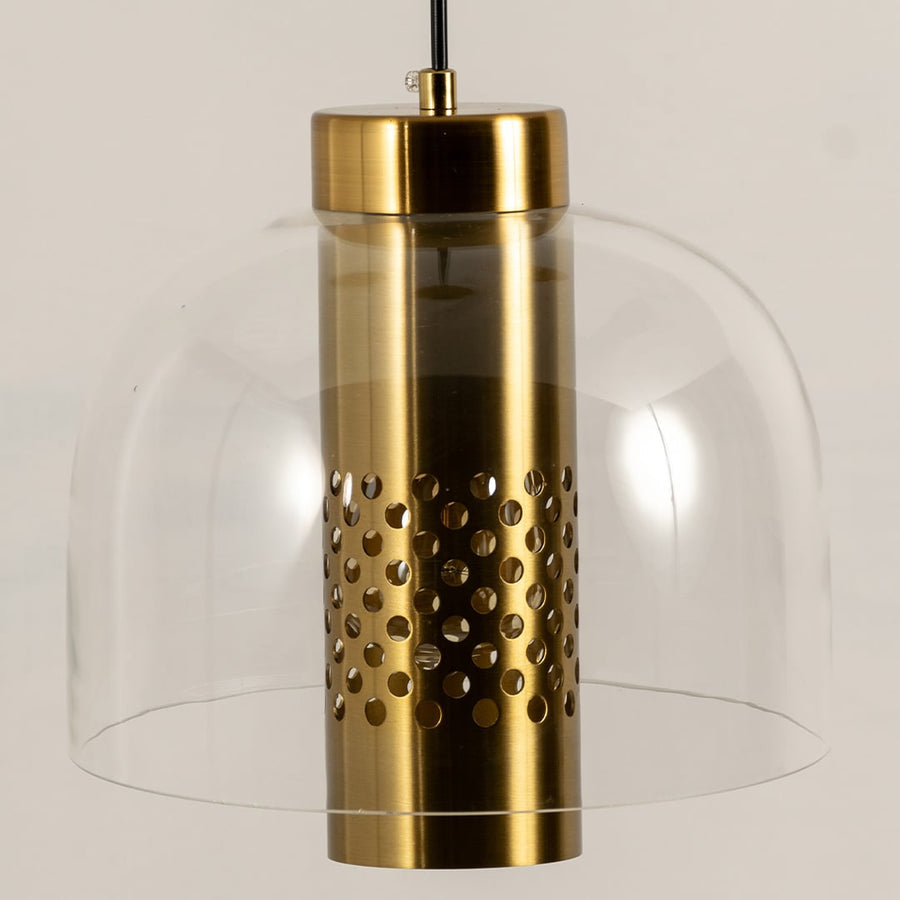 Closeup view of pendant light showing its transparent glass dome and detailed perforated metal cylinder highlighting refined craftsmanship for interior home decor lighting.