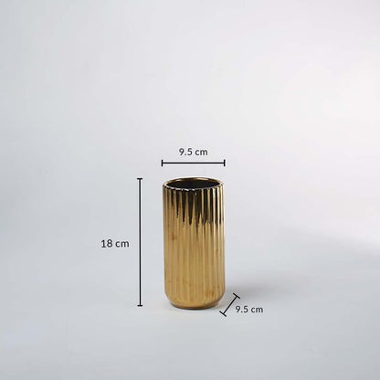 A gold ribbed vase shown with measurements of 18 cm height and 9.5 cm width clearly presenting its compact decorative size in a clean layout.